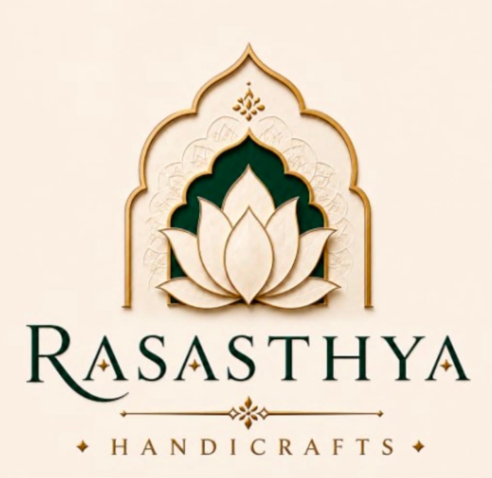 Rasasthya Handicrafts emblem: a marble lotus within a forest-green arch