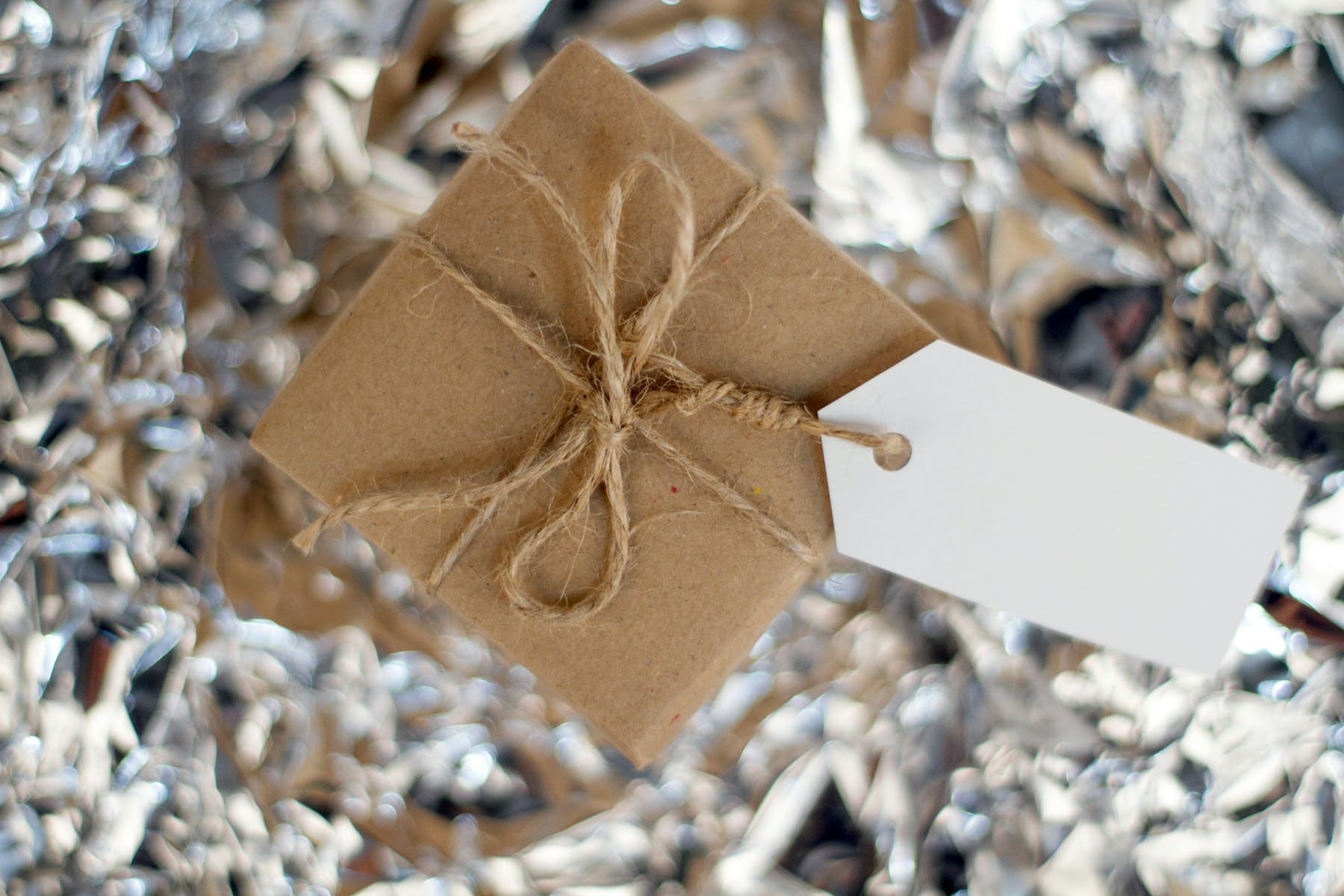 A kraft-wrapped parcel tied with twine, waiting to be opened